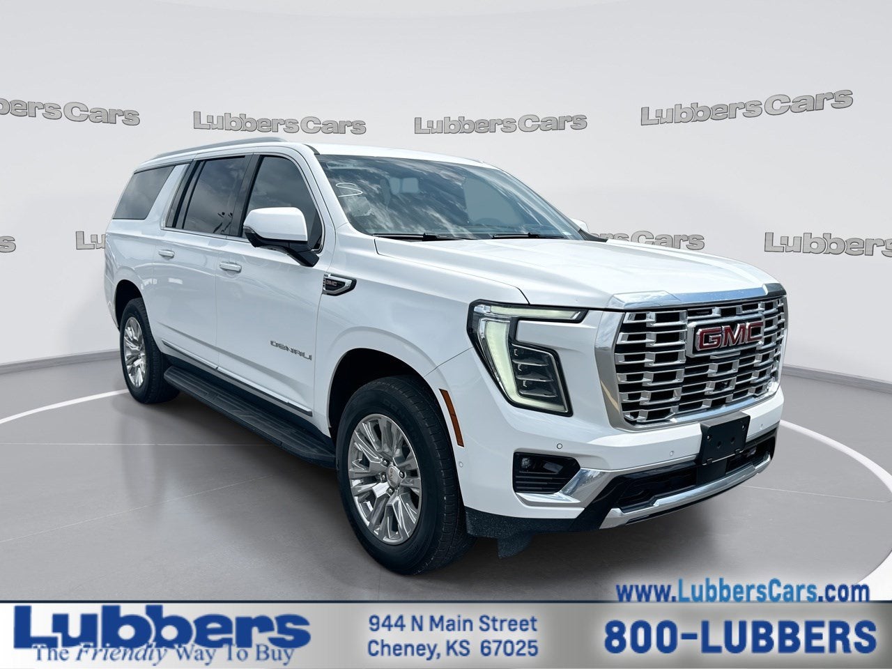 2025 GMC Yukon XL Denali in Summit White — front three-quarter view