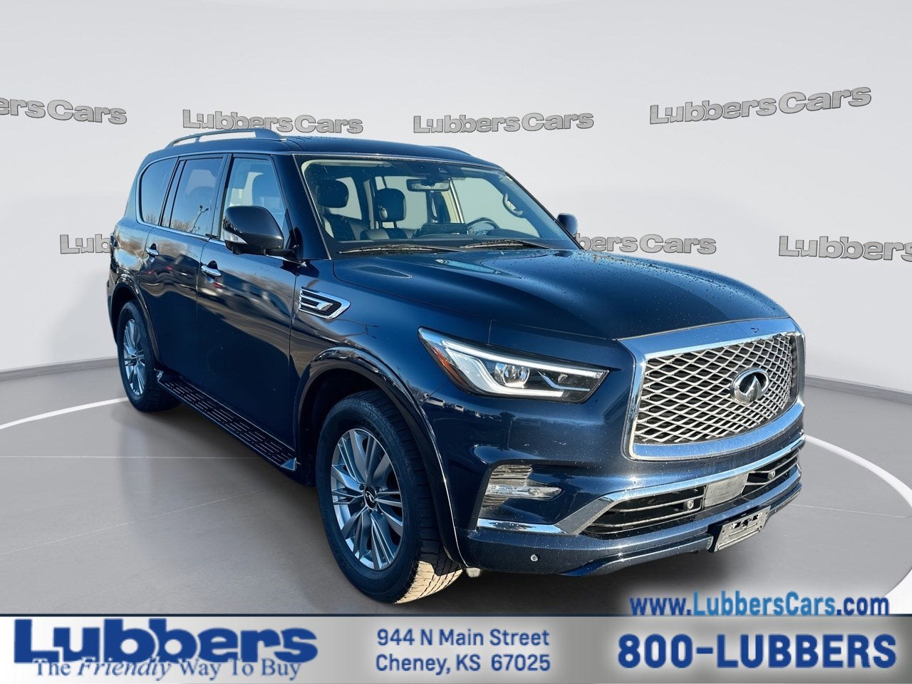 2024 INFINITI QX80 LUXE in Hermosa Blue — front three-quarter view
